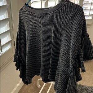 Sweater blouse with bell cap sleeves.